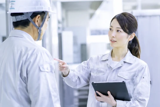 A field worker explaining with a tablet in hand